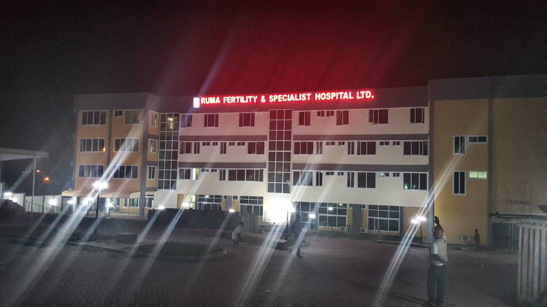 Night exterior of RUMA Fertility & Specialist Hospital Ltd. in Ghana with illuminated facade, host site of the new medical pendant system
